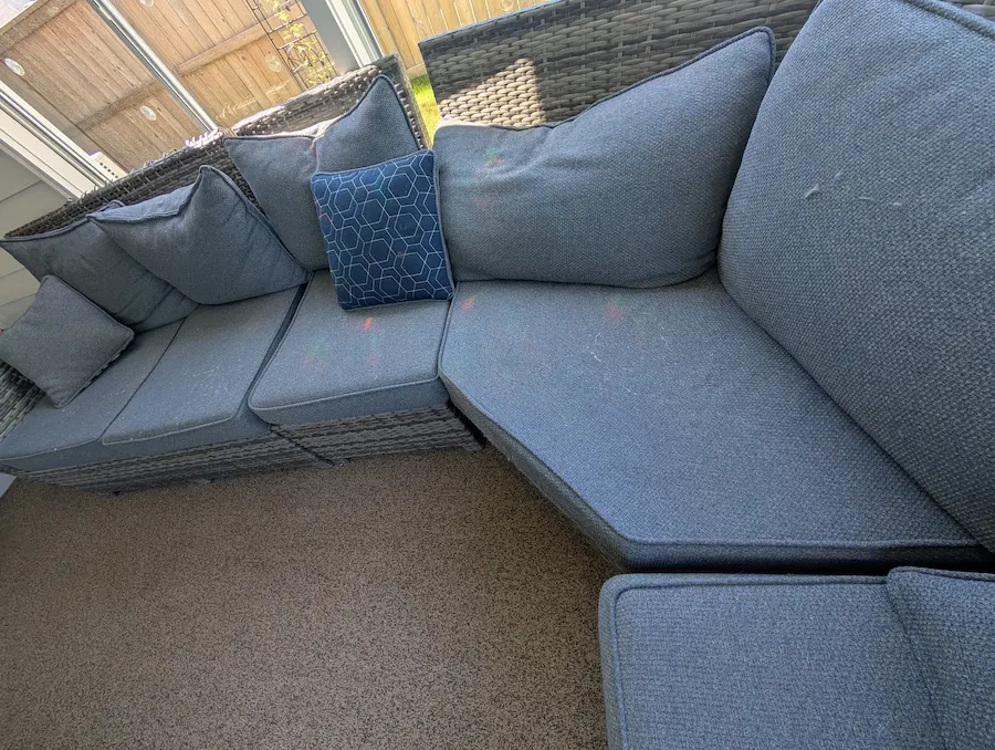 Sofa upholstery with accumulated dust, pet hair, and everyday dirt before vacuum cleaning in Fargo, ND